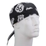A black bandana featuring Route 66 signs is displayed on a white mannequin head the bandana wraps around the head and has a tie at the back suggesting casual wear