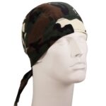 A camouflage bandana is positioned on a white mannequin head facing slightly upward showcasing a mix of greens browns and cream colors in a military pattern  no background is visible.