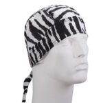 A black and white zebra-striped bandana is worn on a mannequin head styled with a tie at the back in a neutral setting emphasizing the design of the fabric.