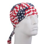 A white mannequin head displays a bandana featuring a design of red and white stripes interspersed with blue sections adorned with white stars reflecting a patriotic theme.