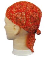 A red bandana with a paisley pattern is tied around the head of a mannequin displaying the fabric's smooth texture and vibrant color against a plain background.