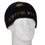 A black knit beanie rests on a white mannequin head featuring yellow embroidery that reads BORN TO BE WILD along the bottom edge against a plain background.
