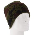 A camouflage-patterned beanie rests on a plain white mannequin head showcasing its green brown and black colors in a neutral background highlighting the hat's design and texture.