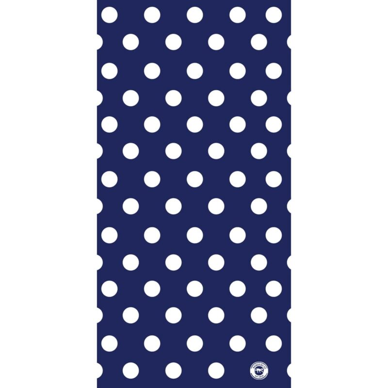 A patterned surface features evenly spaced large white polka dots on a dark blue background creating a visually striking design suitable for fabrics or wallpapers.
