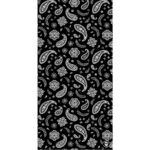 A black fabric features a repeating pattern of white paisley shapes and ornamental designs creating a visually striking contrast suited for textiles or decorative purposes.