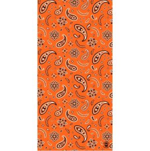 A vibrant orange fabric features a repeating pattern of paisley shapes and floral motifs in black and white creating a lively and decorative textile design.