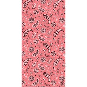 A pink fabric covered with intricate paisley patterns and floral designs creates a vibrant visual texture showcasing contrasting black and white details against a warm background.
