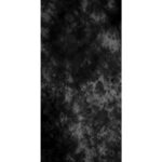 A textured black and gray patterned fabric fills the frame creating a moody and abstract backdrop with swirling shapes and variations in tone throughout the surface.