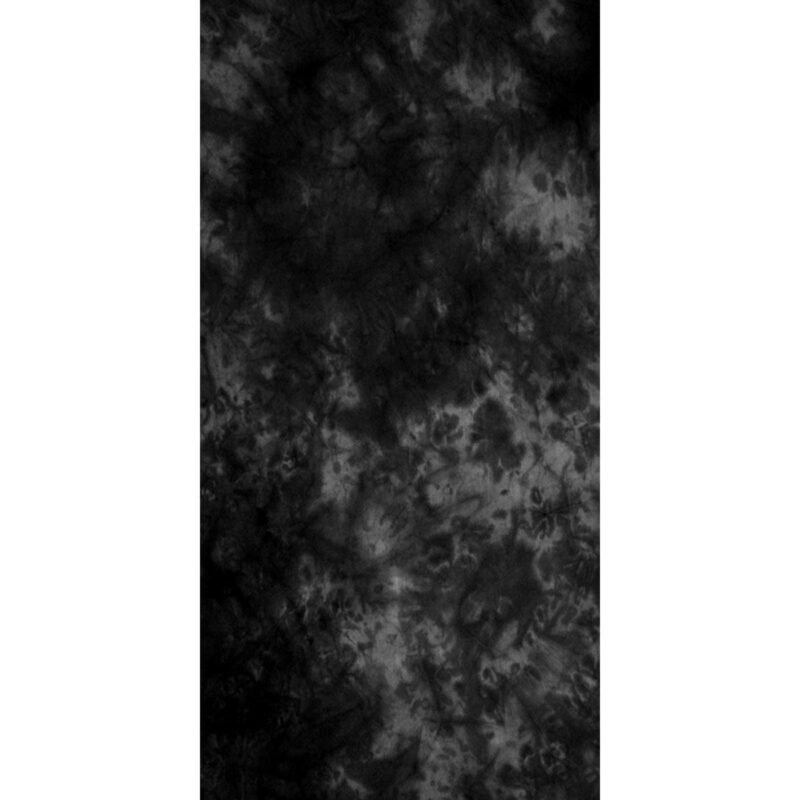 A textured black and gray patterned fabric fills the frame creating a moody and abstract backdrop with swirling shapes and variations in tone throughout the surface.